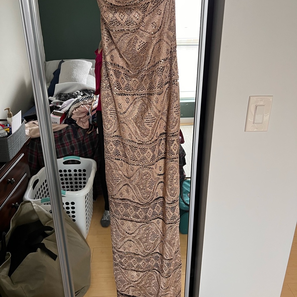Strapless floor length dress.  Fits like a size 2!